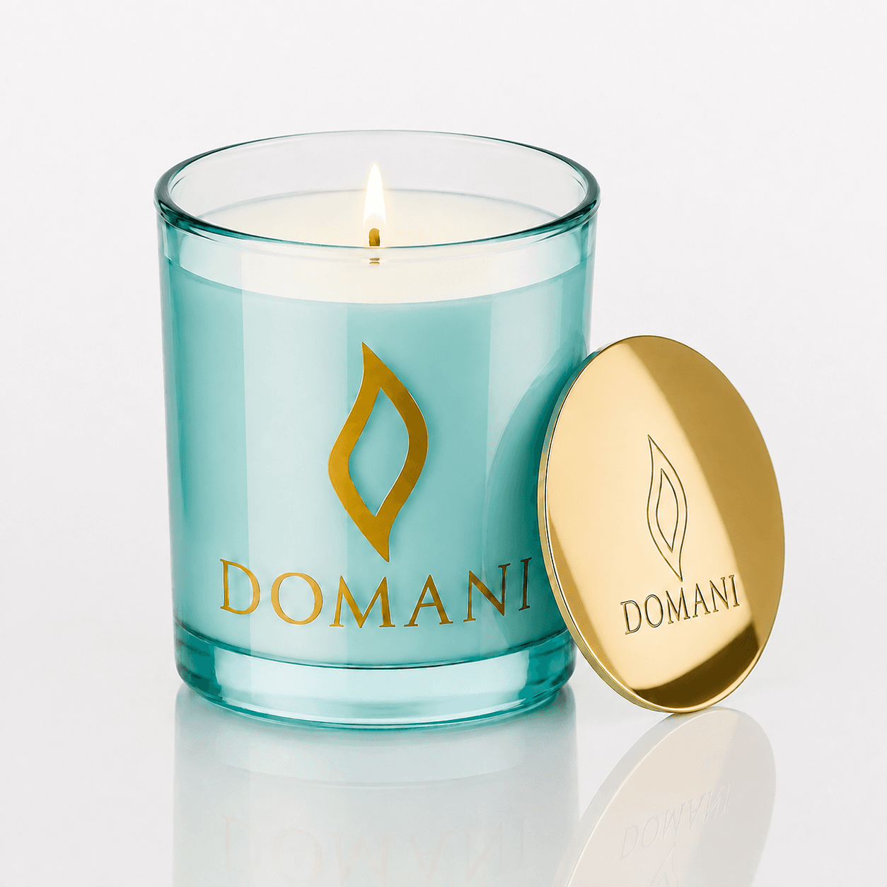Domani Daydreamer candle, Aquamarine · Lit candle, downward view