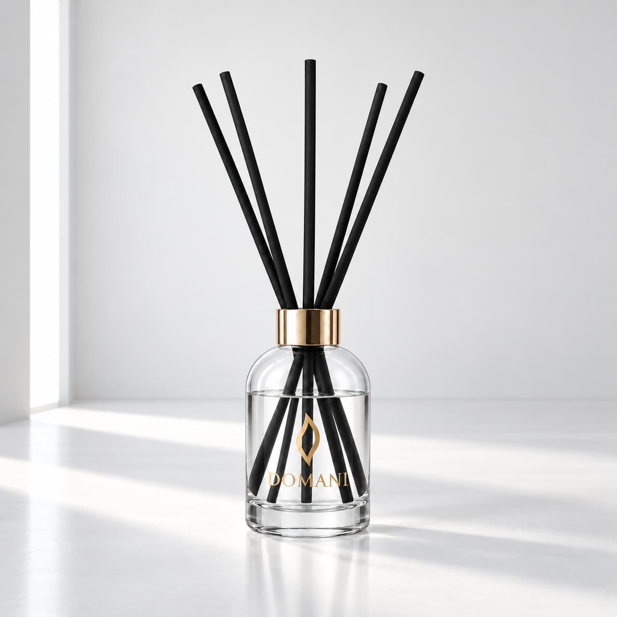 Domani lumina reed diffuser in an editorial interior setting.