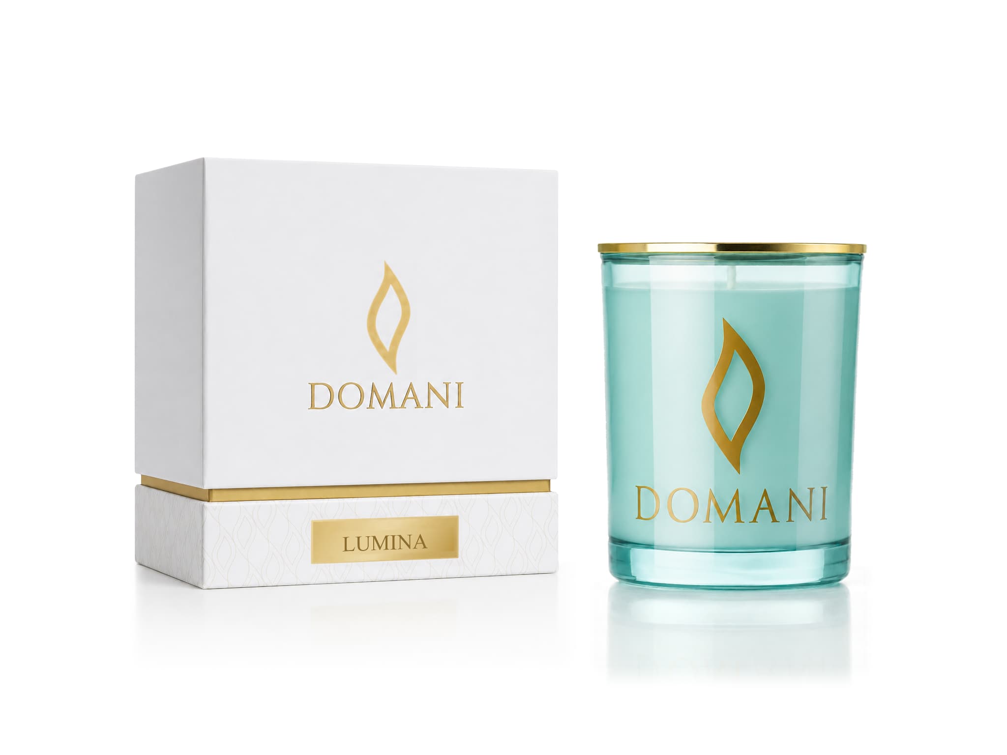 Lumina candle in Aquamarine glass beside its named presentation box.