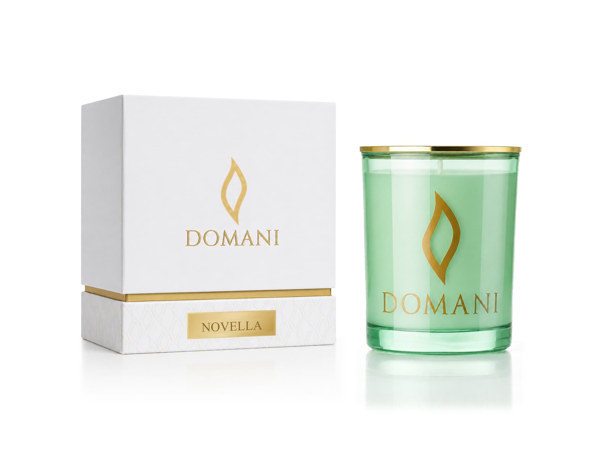 Novella candle in Emerald glass beside its named presentation box.