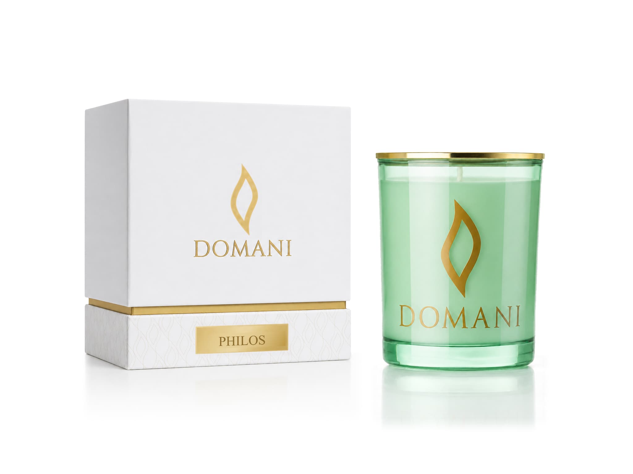 Philos candle in Emerald glass beside its named presentation box.