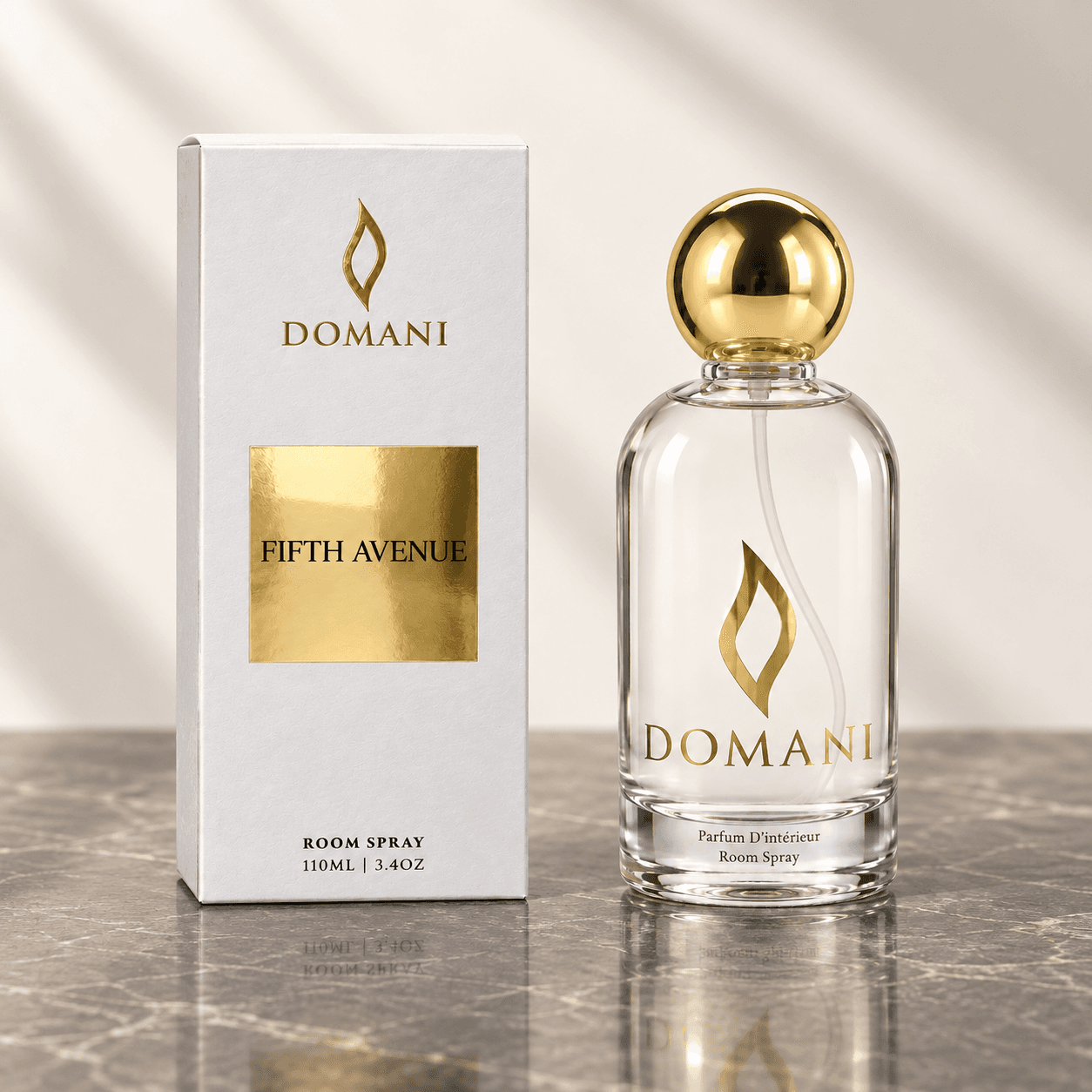 Fifth Avenue room spray beside a carton bearing its fragrance name